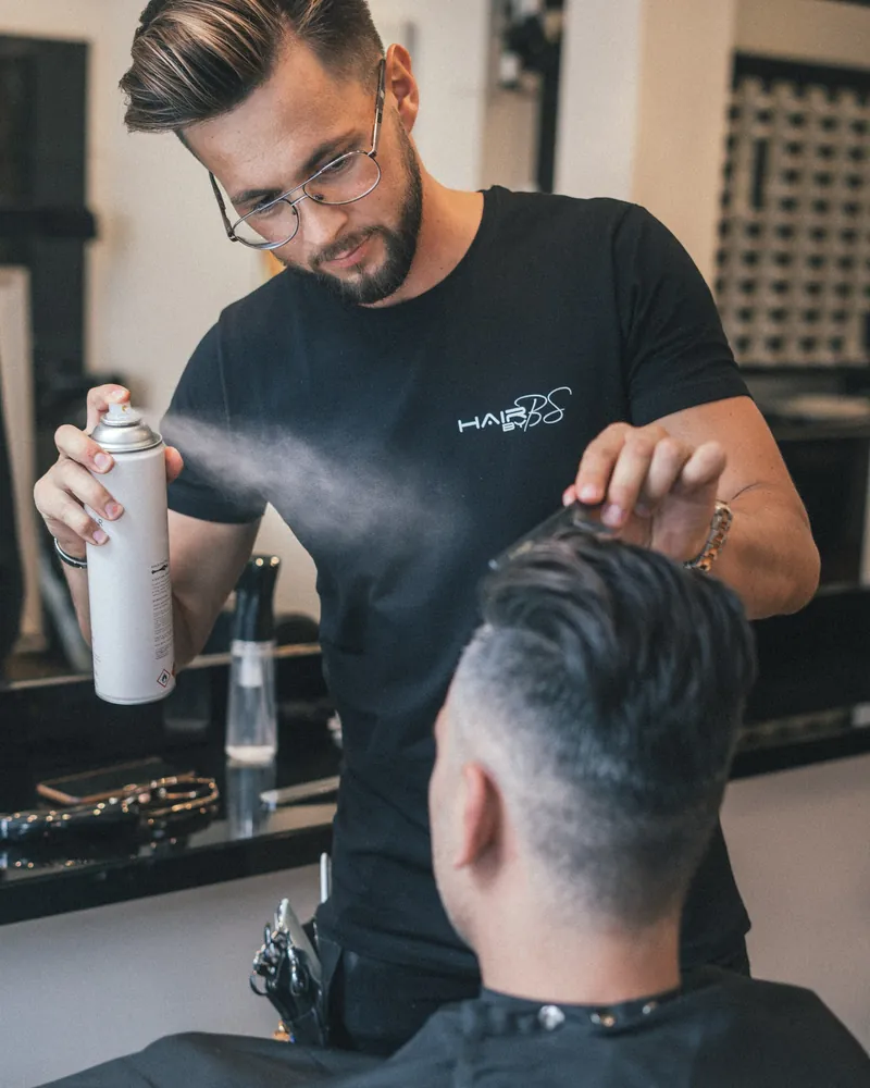 Barber Two finishing a fade at the station