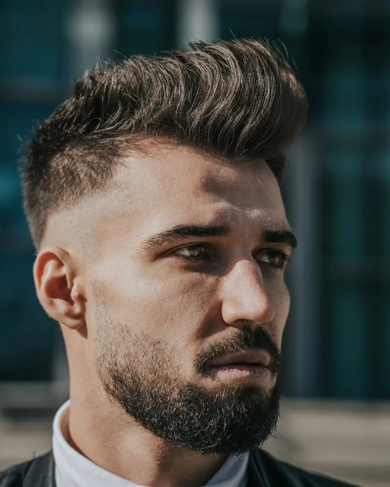Barber Three, portrait with a textured quiff and full beard